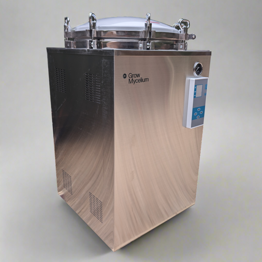Stainless steel autoclave with 'Grow Mycology' branding on a gray background